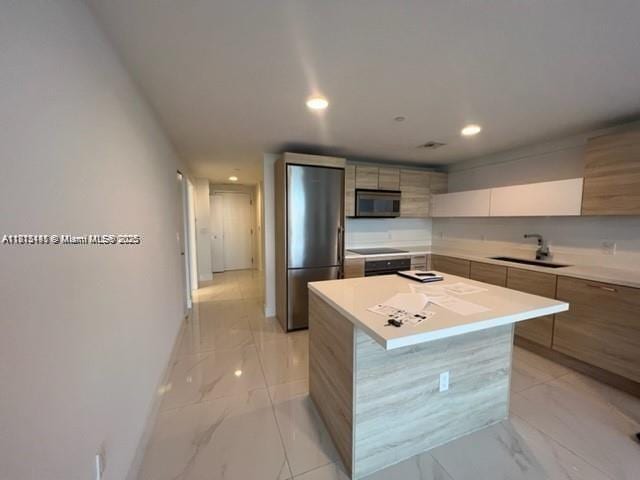 16385 Biscayne Blvd Unit 820, North Miami Beach, FL 33160 - kitchen with a sink, appliances with stainless steel finishes, modern cabinets, light marble finish floors, and recessed lighting