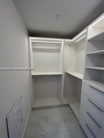 16385 Biscayne Blvd Unit 820, North Miami Beach, FL 33160 - spacious closet featuring marble look tiles