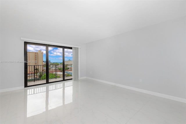 1201 S Ocean Dr Unit 610N, Hollywood, FL 33019 - spare room featuring baseboards and marble finish floors