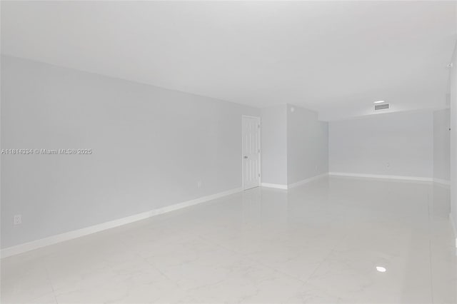 1201 S Ocean Dr Unit 610N, Hollywood, FL 33019 - empty room featuring baseboards and marble finish flooring