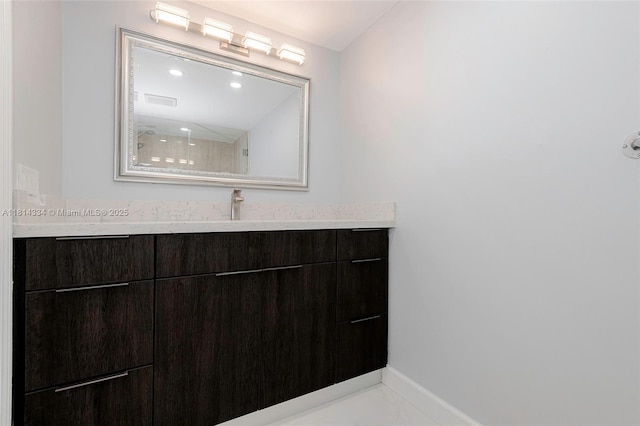 1201 S Ocean Dr Unit 610N, Hollywood, FL 33019 - bathroom featuring vanity, baseboards, marble finish floors, and recessed lighting
