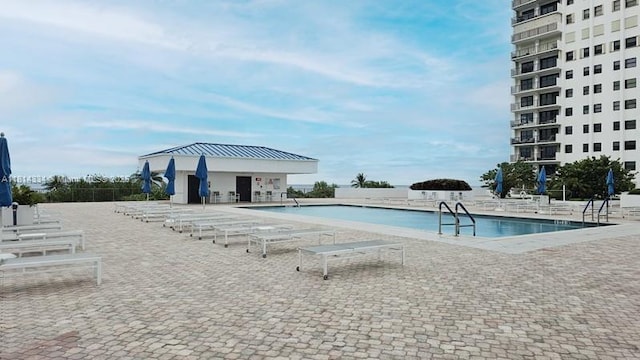 1201 S Ocean Dr Unit 610N, Hollywood, FL 33019 - community pool featuring a patio