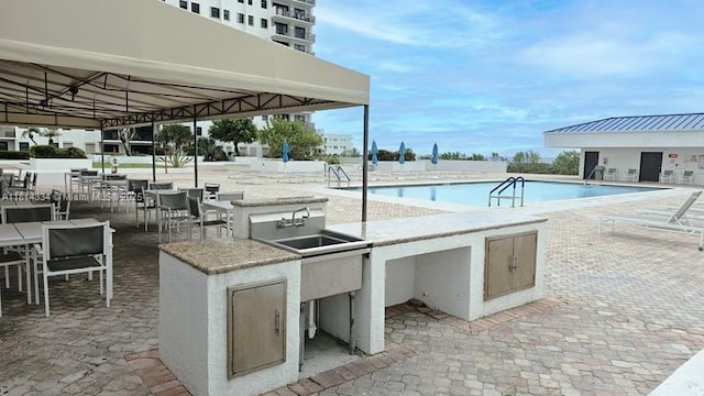 1201 S Ocean Dr Unit 610N, Hollywood, FL 33019 - community pool with area for grilling and a patio