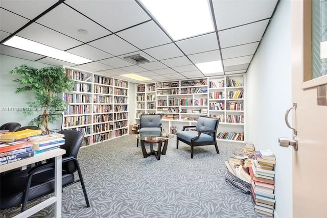 1201 S Ocean Dr Unit 610N, Hollywood, FL 33019 - living area with wall of books, carpet, and built in shelves