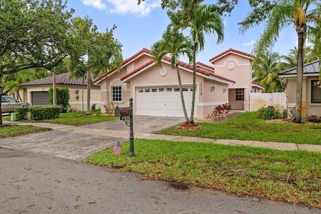 17610 SW 4th Ct, Pembroke Pines, FL 33029 - mediterranean / spanish-style house with an attached garage, stucco siding, a tiled roof, and driveway
