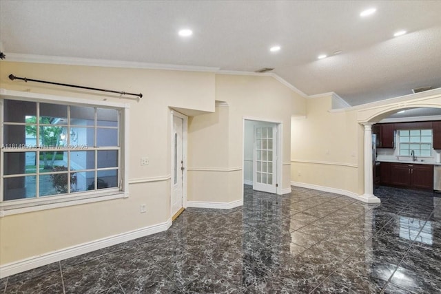 17610 SW 4th Ct, Pembroke Pines, FL 33029 - spare room with ornamental molding, lofted ceiling, baseboards, a sink, and arched walkways
