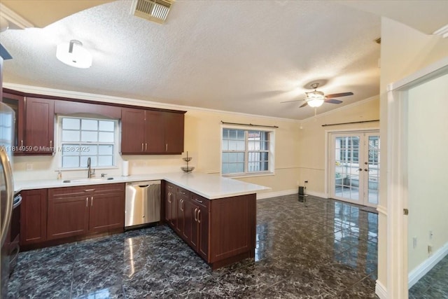 17610 SW 4th Ct, Pembroke Pines, FL 33029 - kitchen with a sink, dishwasher, a peninsula, crown molding, and baseboards