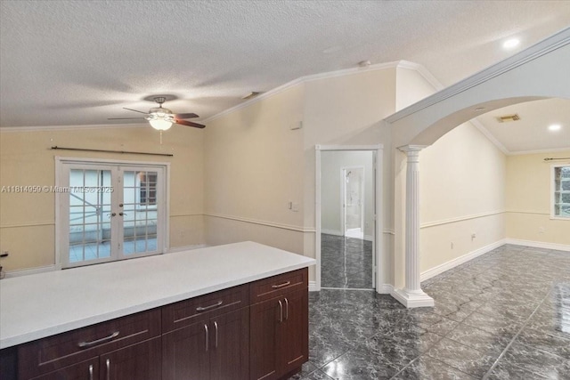 17610 SW 4th Ct, Pembroke Pines, FL 33029 - kitchen with arched walkways, ceiling fan, ornate columns, a textured ceiling, and ornamental molding