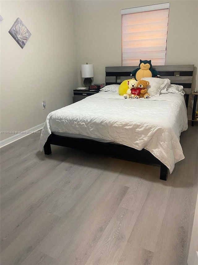 16365 SW 47th Ter, Ocala, FL 34473 - bedroom with wood finished floors and baseboards