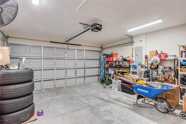 16365 SW 47th Ter, Ocala, FL 34473 - garage with electric panel, a garage door opener, and concrete block wall