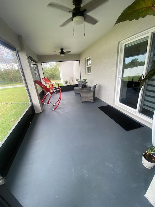 16365 SW 47th Ter, Ocala, FL 34473 - unfurnished sunroom featuring ceiling fan and outdoor lounge area