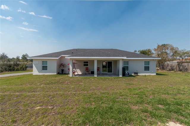 16365 SW 47th Ter, Ocala, FL 34473 - rear view of property featuring a patio, a lawn, and stucco siding