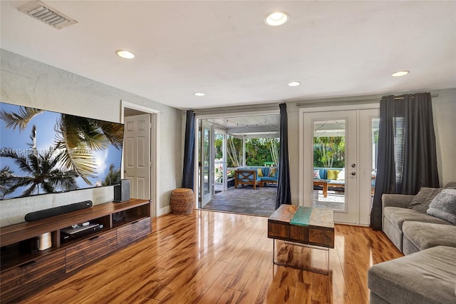 1083 SW 25th Pl, Boynton Beach, FL 33426 - living room with light wood-style floors, recessed lighting, and french doors