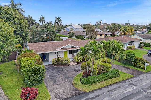 1083 SW 25th Pl, Boynton Beach, FL 33426 - ranch-style home with driveway, a residential view, and stucco siding