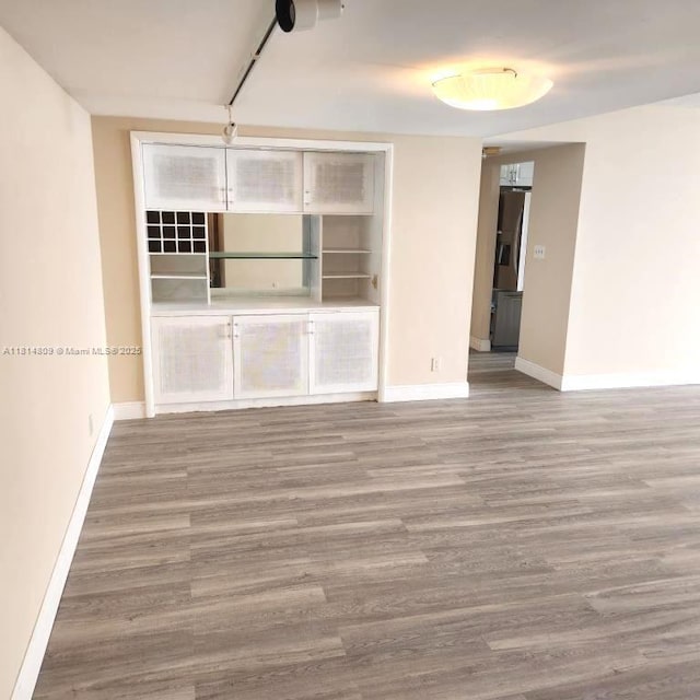 1801 S Flagler Dr Unit 1505, West Palm Beach, FL 33401 - unfurnished room with baseboards and wood finished floors