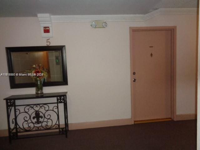 9320 Fontainebleau Blvd Unit 503, Miami, FL 33172 - corridor featuring baseboards and ornamental molding