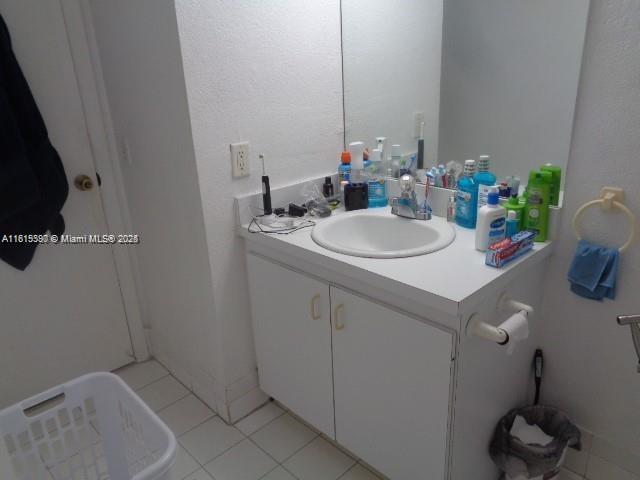 9320 Fontainebleau Blvd Unit 503, Miami, FL 33172 - bathroom with vanity and tile patterned floors