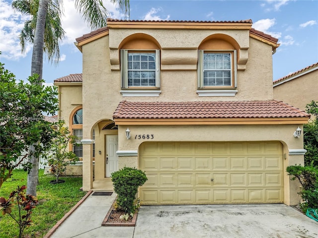 15683 NW 12th Rd, Pembroke Pines, FL 33028 - mediterranean / spanish house featuring an attached garage, a tile roof, and stucco siding