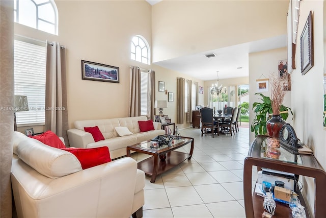 15683 NW 12th Rd, Pembroke Pines, FL 33028 - living area featuring plenty of natural light, a chandelier, light tile patterned floors, and a towering ceiling