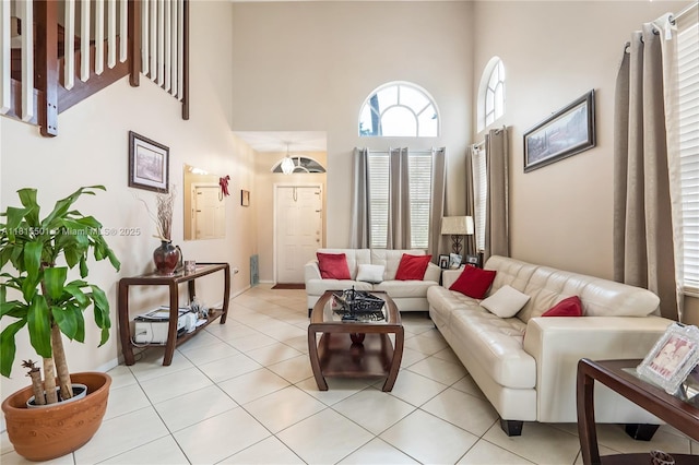 15683 NW 12th Rd, Pembroke Pines, FL 33028 - living room featuring a high ceiling, baseboards, and light tile patterned floors