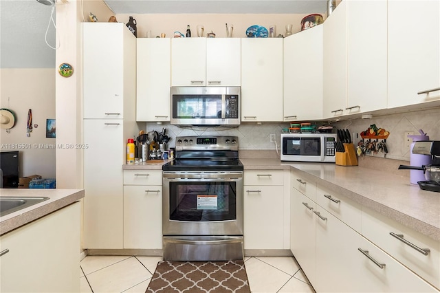 15683 NW 12th Rd, Pembroke Pines, FL 33028 - kitchen with stainless steel appliances, light countertops, and backsplash