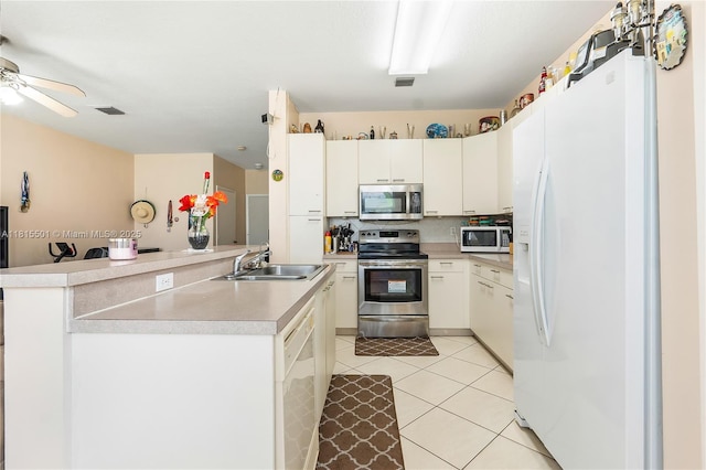 15683 NW 12th Rd, Pembroke Pines, FL 33028 - kitchen featuring appliances with stainless steel finishes, a sink, light tile patterned floors, light countertops, and ceiling fan