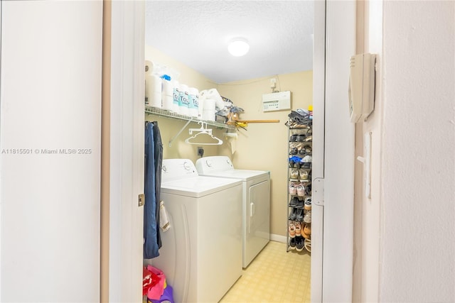 15683 NW 12th Rd, Pembroke Pines, FL 33028 - washroom with washing machine and clothes dryer, light flooring, and a textured ceiling