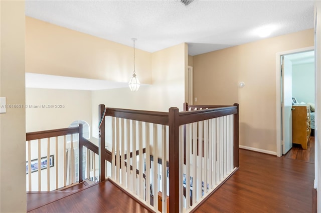 15683 NW 12th Rd, Pembroke Pines, FL 33028 - hallway with an upstairs landing, wood finished floors, and baseboards