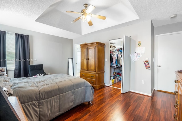 15683 NW 12th Rd, Pembroke Pines, FL 33028 - bedroom with dark wood-type flooring, a textured ceiling, baseboards, a closet, and a ceiling fan