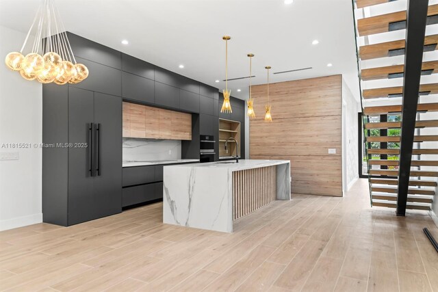 1812 Miami Rd, Fort Lauderdale, FL 33316 - kitchen with modern cabinets, dark cabinetry, light countertops, recessed lighting, and a sink
