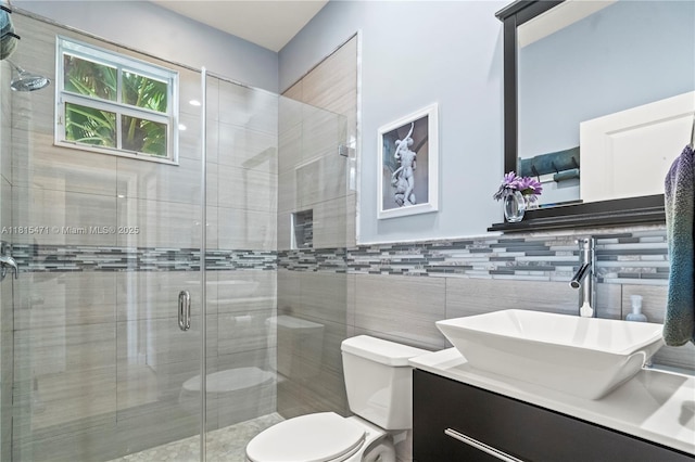 3063 NW 126th Ave, Sunrise, FL 33323 - bathroom with vanity, a stall shower, and tile walls