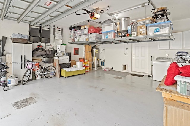 3063 NW 126th Ave, Sunrise, FL 33323 - garage featuring washer / clothes dryer, gas water heater, and a garage door opener