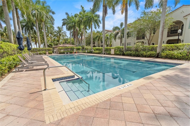 3063 NW 126th Ave, Sunrise, FL 33323 - community pool featuring a patio area