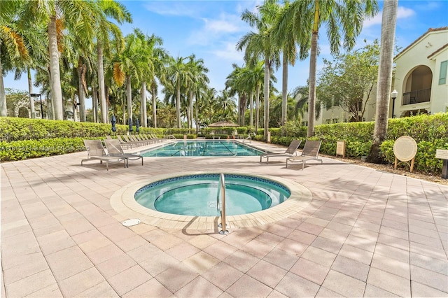 3063 NW 126th Ave, Sunrise, FL 33323 - community pool with a community hot tub and a patio