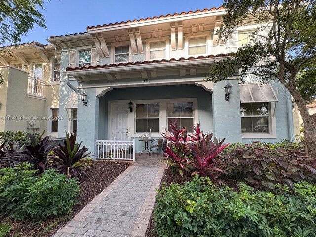 3311 NW 125th Ln, Sunrise, FL 33323 - mediterranean / spanish-style house with covered porch