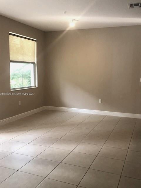 3311 NW 125th Ln, Sunrise, FL 33323 - empty room with baseboards and light tile patterned floors