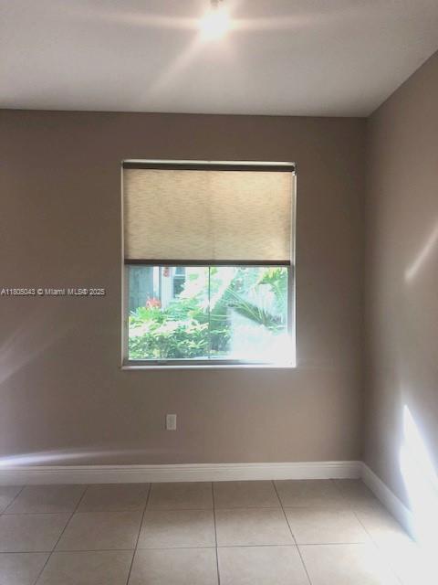 3311 NW 125th Ln, Sunrise, FL 33323 - unfurnished room featuring light tile patterned floors and baseboards