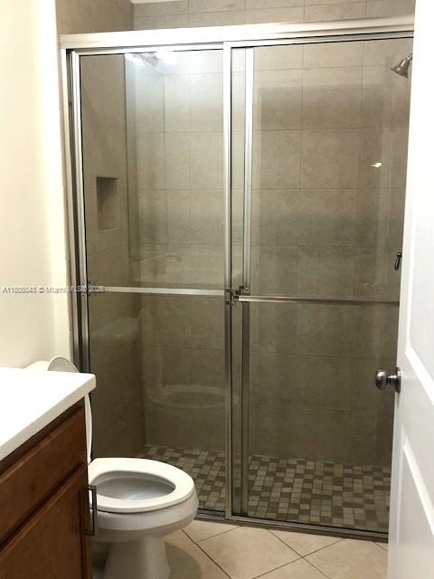 3311 NW 125th Ln, Sunrise, FL 33323 - full bath featuring vanity, a stall shower, and toilet
