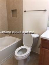 3311 NW 125th Ln, Sunrise, FL 33323 - full bath featuring toilet, a tub to relax in, and vanity