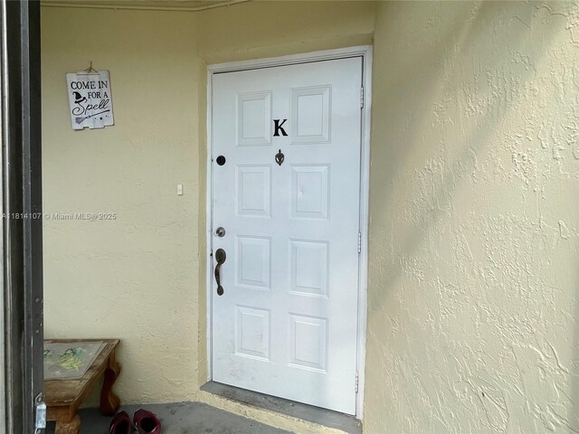 1150 N Liberty Ave Unit K, Homestead, FL 33034 - view of exterior entry featuring stucco siding
