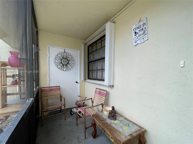 1150 N Liberty Ave Unit K, Homestead, FL 33034 - doorway to property with stucco siding and a porch