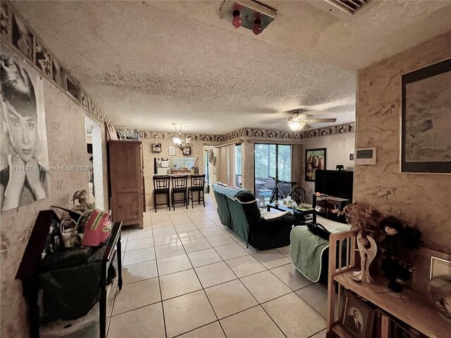 1150 N Liberty Ave Unit K, Homestead, FL 33034 - living area featuring a textured ceiling, a ceiling fan, and light tile patterned floors