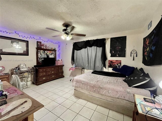 1150 N Liberty Ave Unit K, Homestead, FL 33034 - bedroom featuring light tile patterned floors, a textured ceiling, and a ceiling fan
