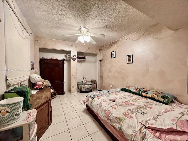 1150 N Liberty Ave Unit K, Homestead, FL 33034 - bedroom with a textured ceiling, light tile patterned floors, and ceiling fan
