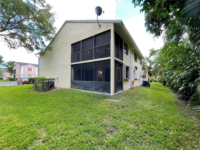 1150 N Liberty Ave Unit K, Homestead, FL 33034 - back of house with stucco siding and a yard