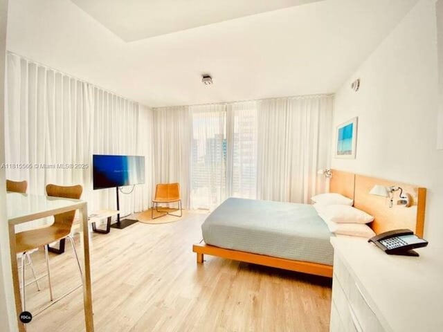6080 Collins Ave Unit Ph09, Miami Beach, FL 33140 - bedroom with light wood finished floors