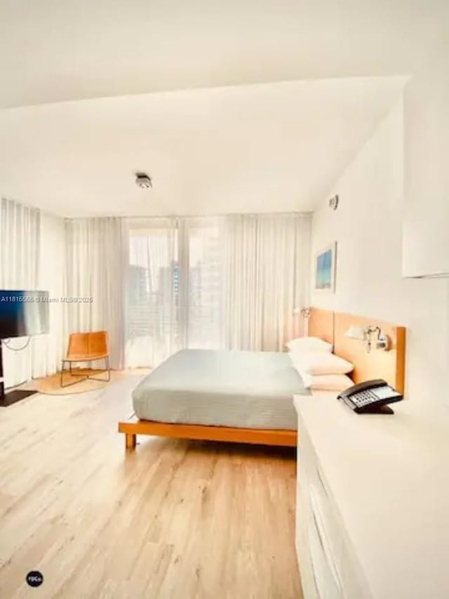 6080 Collins Ave Unit Ph09, Miami Beach, FL 33140 - bedroom featuring light wood finished floors