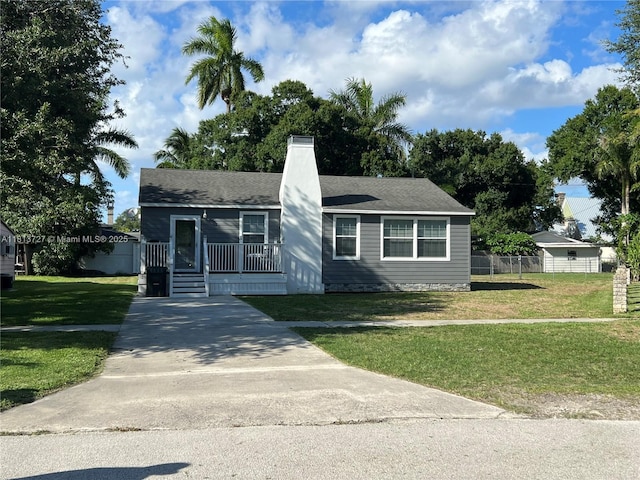 416 N Deane Duff Ave, Clewiston, FL 33440 - ranch-style house with a chimney, concrete driveway, and covered porch