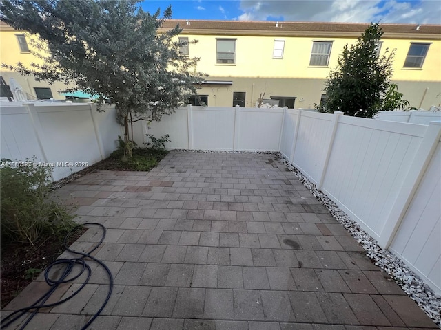 10617 W 33rd Way, Hialeah, FL 33018 - fenced backyard with a patio