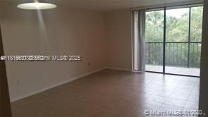 8045 SW 107th Ave Unit 323, Miami, FL 33173 - empty room with baseboards